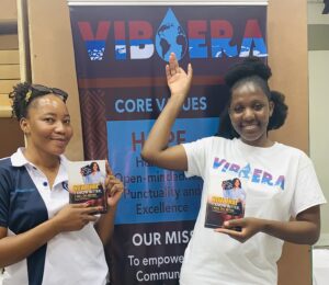 Posing with the author of “NOW THAT I KNOW BETTER I WILL DO BETTER” and Chair Lady of “Second Chance Foundation “ on site